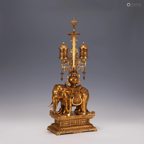 A GILT BRONZE ELEPHANT WITH CANDLESTICK