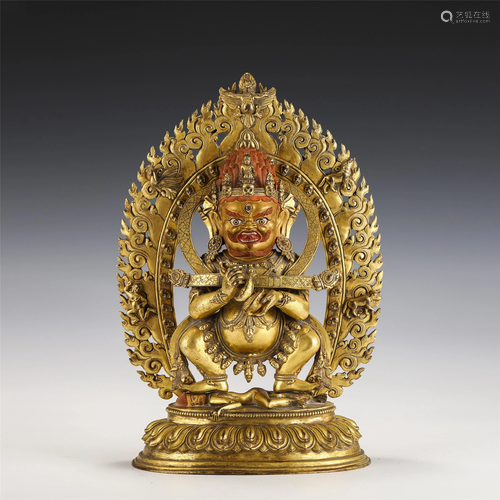 A GILT-BRONZE STANDING PROTECTOR