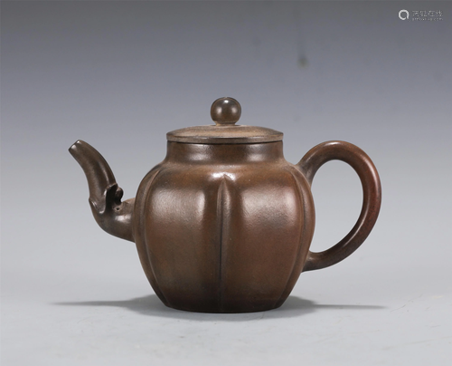 A YIXING GLAZED TEAPOT