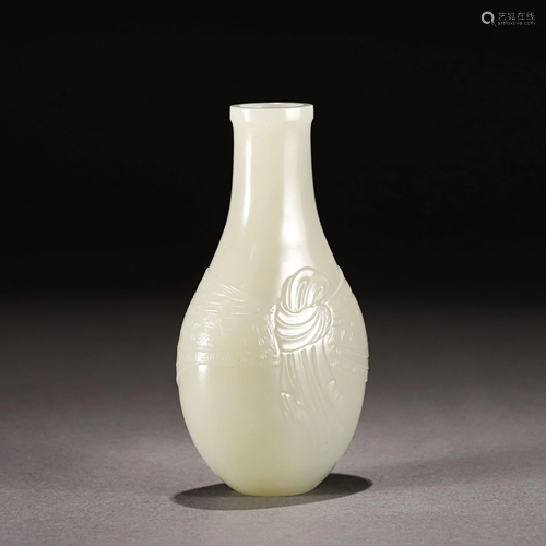 A CARVED WHITE JADE VASE