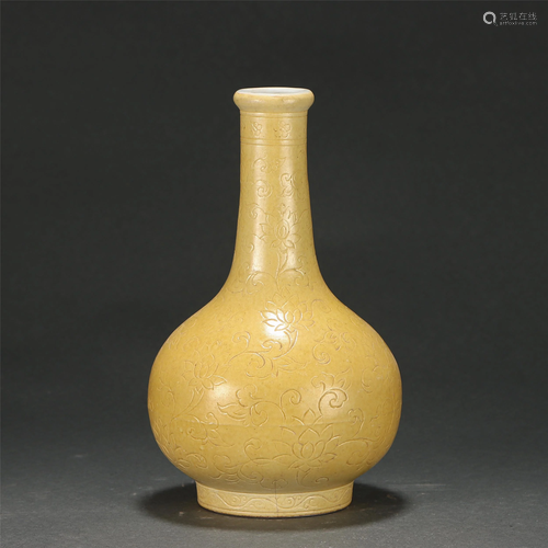 AN INCISED YELLOW GLAZED LOTUS SCROLLS BOTTLE VASE