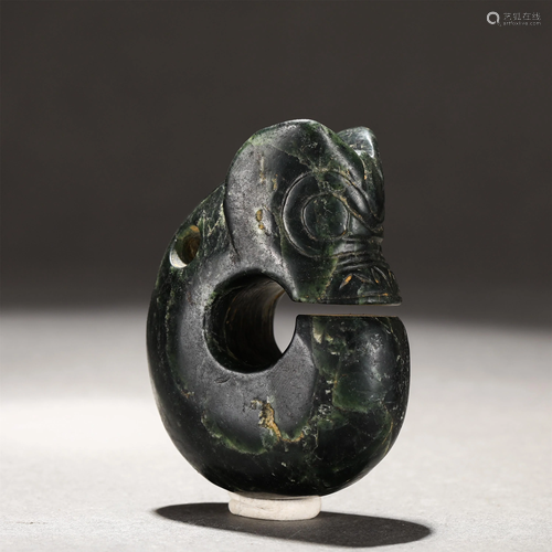 A CARVED DARK GREEN JADE PIG-DRAGON