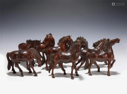 A GROUP OF EIGHTEEN CARVED ANNATTO HORSES