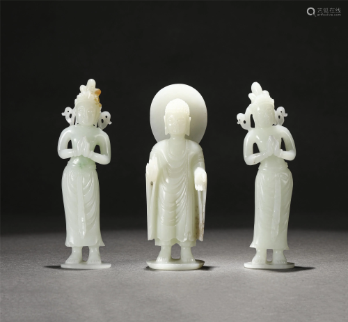 A VERY RARE CARVED WHITE JADE STANDING SHAKYAMUNI WITH
