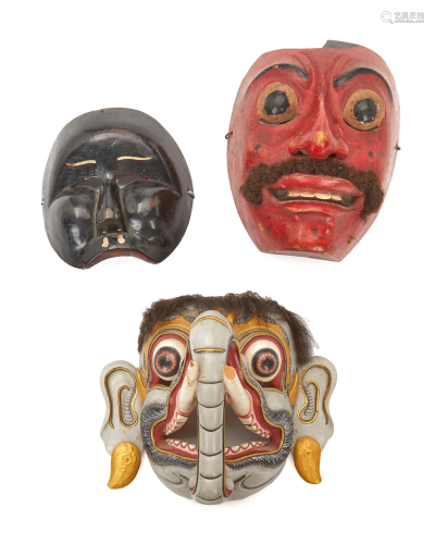 Three Indonesian carved wood figural masks