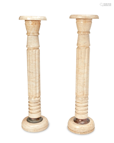 A pair of marble pedestals