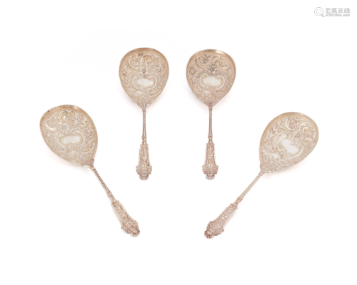 Four English sterling silver berry spoons