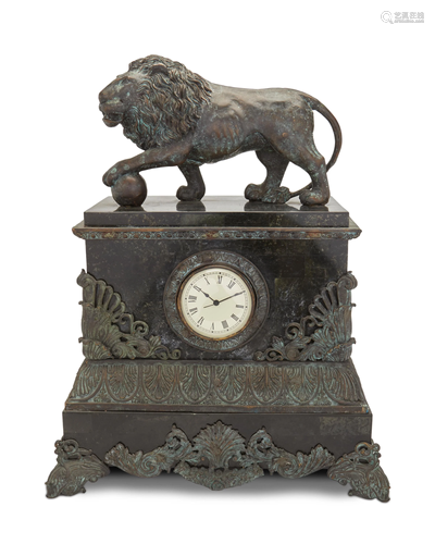 A patinated metal and marble mantel clock