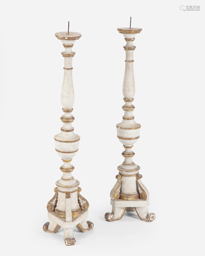 A pair of large Continental painted wood pricket