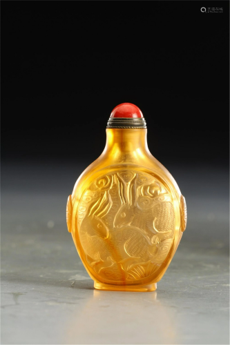 A CHINESE YELLOW GLASS CARVED RABBITS SNUFF BOTTLE