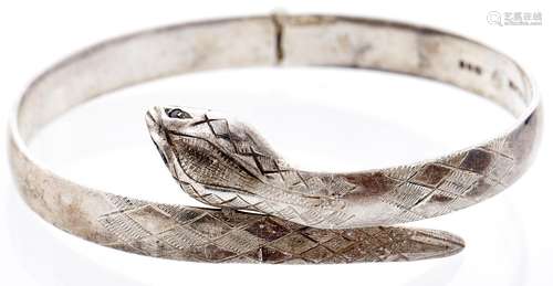 A silver snake bangle, London 1979