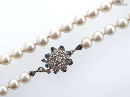 A cultured pearl necklace with sapphire and diamond set whit...