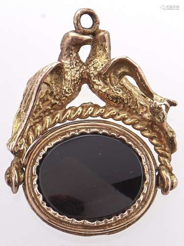 An onyx set 9ct gold swivel fob seal, with billing doves mou...