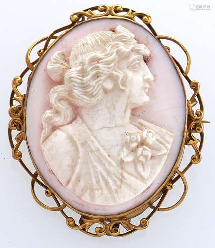 A white coral cameo of the head of a bacchante, set in a gol...