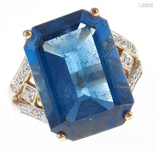 A blue topaz cocktail ring, with diamond shoulders, in gold ...