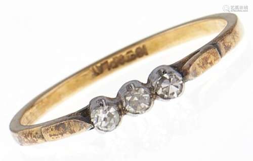 A three stone diamond ring, in gold marked 18ct & PLAT, 2g, ...