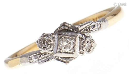 A three stone diamond ring, in gold marked 18ct & PLAT, 3.1g...