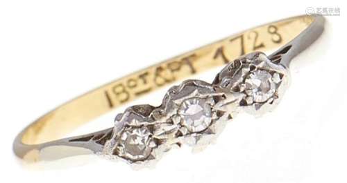 A three stone diamond ring, in gold marked 18ct & PT, 1.8g, ...