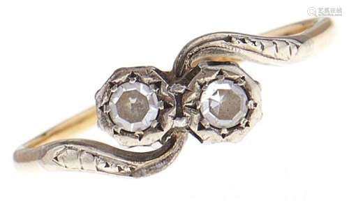 A diamond crossover ring, in gold marked 18ct PLAT, 2g, size...