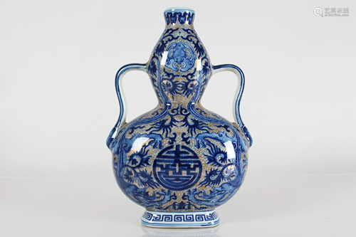 A Chinese Gilt Bat-framing Blue and White Porcelain