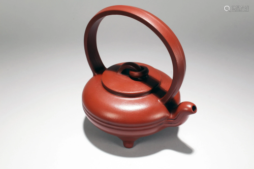 A Chinese Tri-podded Circular Fortune Tea Pot
