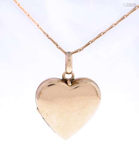 A 9ct gold heart shaped locket, 20mm, Chester 1958 and a 9ct...
