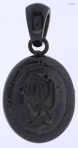 A Victorian jet mourning locket, c1870, carved with a monogr...