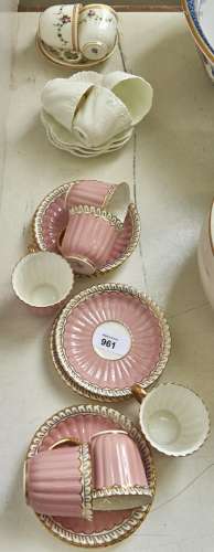 A set of six Royal Crown Derby fluted pink and gilt coffee c...