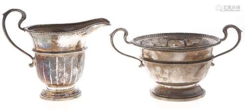 A George V silver cream jug and sugar bowl, jug 95mm h, by A...