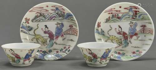 A pair of Chinese famille rose tea bowls and saucers, Qing d...