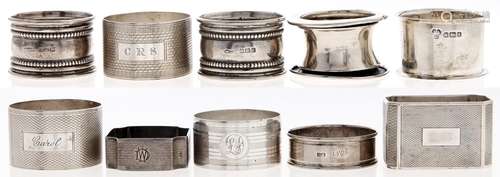 Eleven silver napkin rings, various English makers and dates...