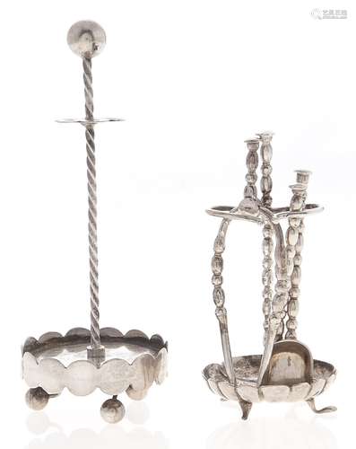 A set of three Dutch miniature silver fire tools and stand a...