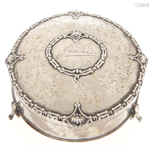 A George V round silver trinket box on three feet, engraved ...