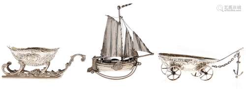 A Dutch miniature silver model of a boat on wheeled carriage...