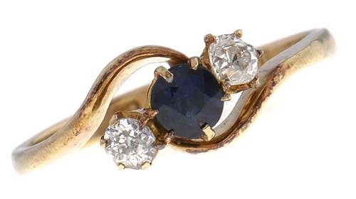 A sapphire and diamond crossover ring, in 18ct gold, Chester...