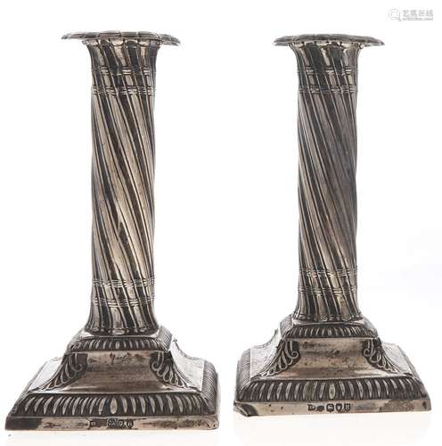 A pair of Victorian dwarf silver columnar candlesticks, spir...