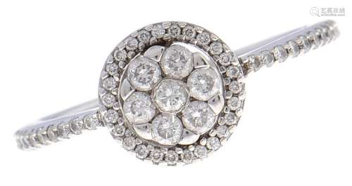 A diamond cluster ring, with diamond shoulders, in white gol...