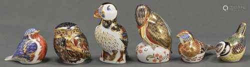 Six Royal Crown Derby paperweights, in the form of a linnet ...