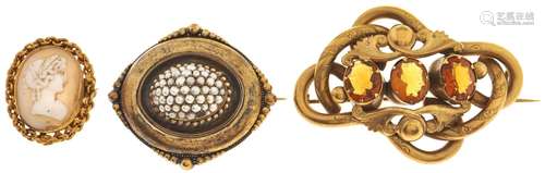 A cameo brooch, and two Victorian giltmetal brooches, variou...