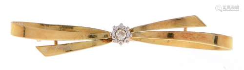A diamond bow brooch, c1930, illusion set in gold, 50mm, mar...