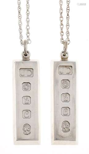 Britannia Standard. Two silver ingot pendants and silver (.9...