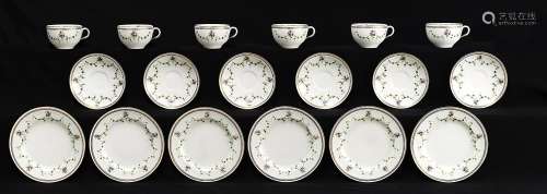 A set of six Royal Worcester jewelled teacups, saucers and p...