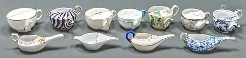 Eleven English and Continental porcelain spout cups, late 19...