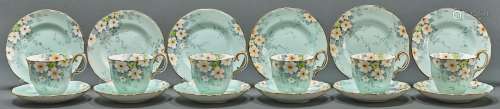 A set of six Crown Staffordshire pale blue ground floral tea...