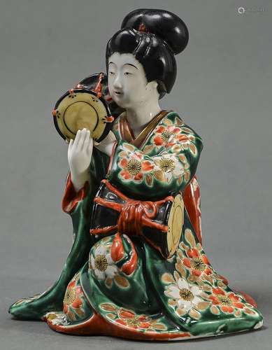 A Japanese Imari figure of a bijin with drums, 20th c, flat ...