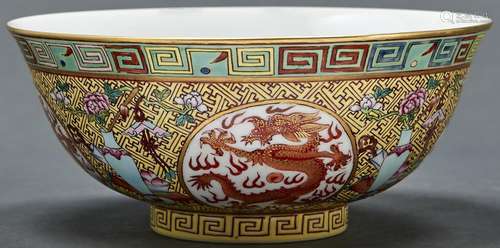 A Chinese yellow ground porcelain bowl, painted in iron red ...