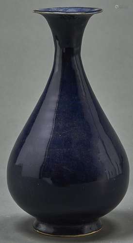 A Chinese blue monochrome glazed vase, with flared neck and ...