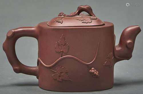 A Chinese Yixing stoneware teapot and cover, of oblong form ...