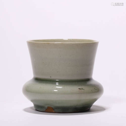 A Chinese Porcelain Celadon-Glazed Jar