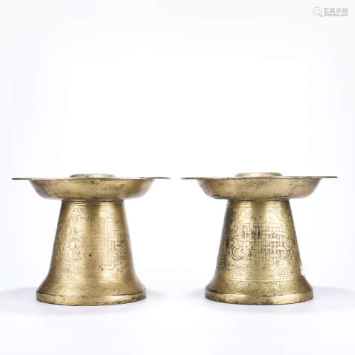 A Pair of Chinese Gilt-Bronze Candle Holders